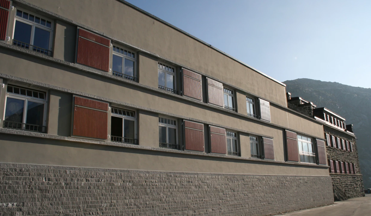 Side view of a modern building with open shutters