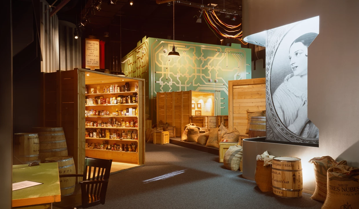 Shelves with coffee products and wooden crates in an exhibition room
