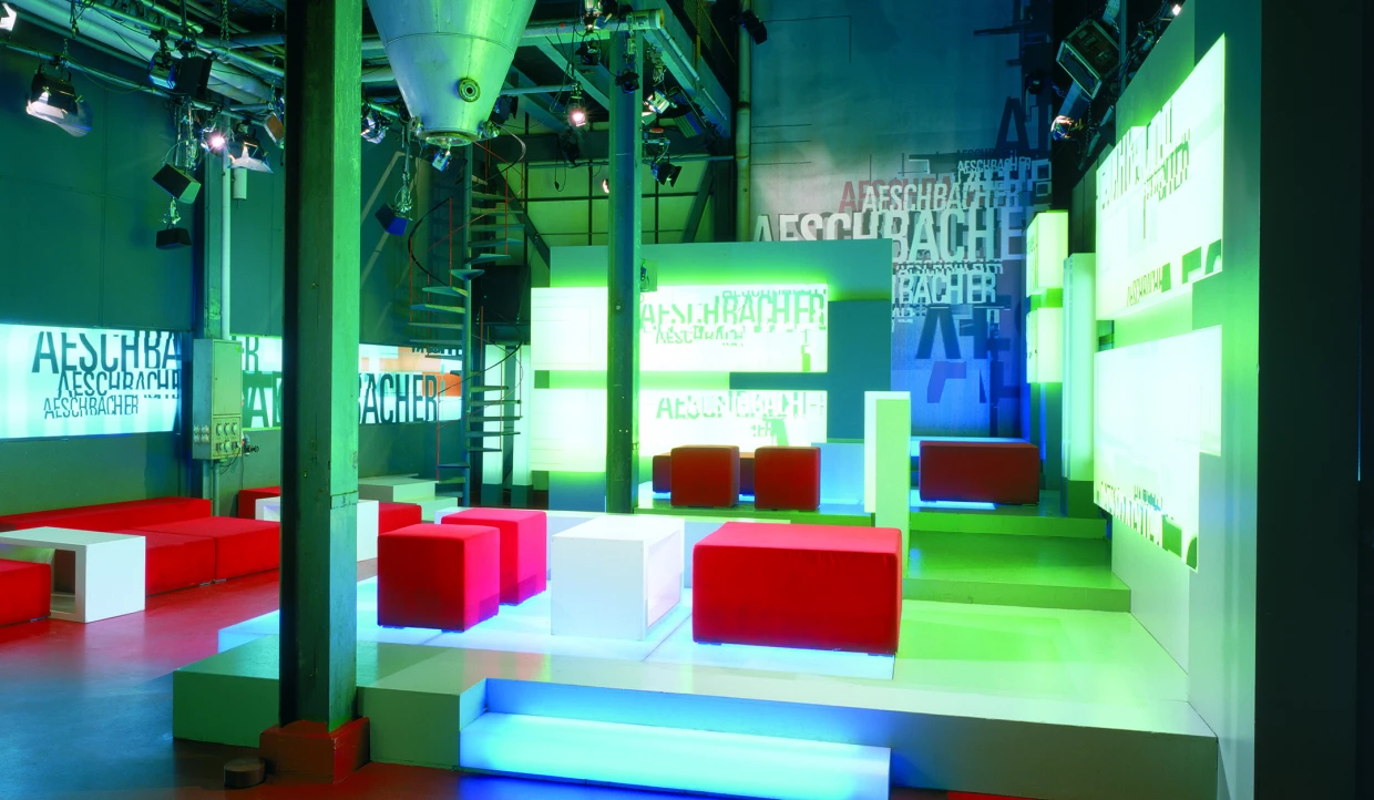 Stage with colorful lights and seating areas