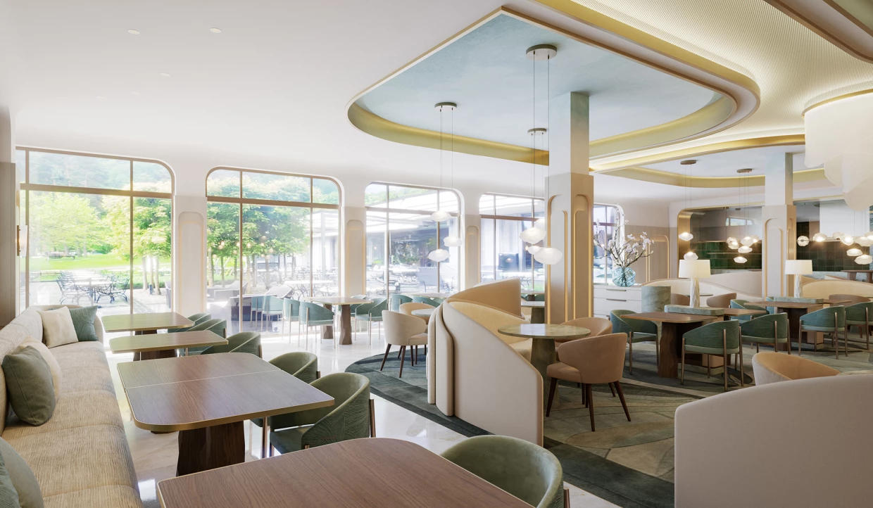 Helles Restaurant mit großen Fenstern und grünen Stühlen