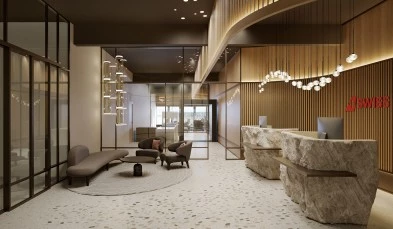 Modern reception with stone counter, glass walls, and designer lighting