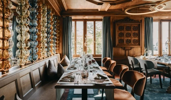 Dining area with set tables and colorful glass chains