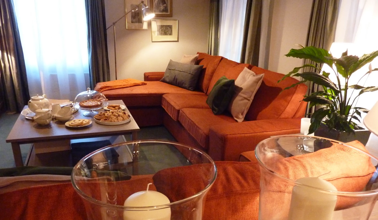 Cozy living room with orange sofa and coffee table