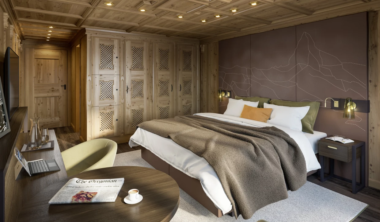 Hotelzimmer mit Holzmöbeln, großem Bett und kleinem Schreibtisch