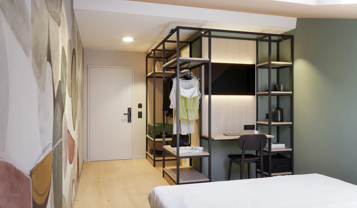 Hotel room with wall art, TV, and work area