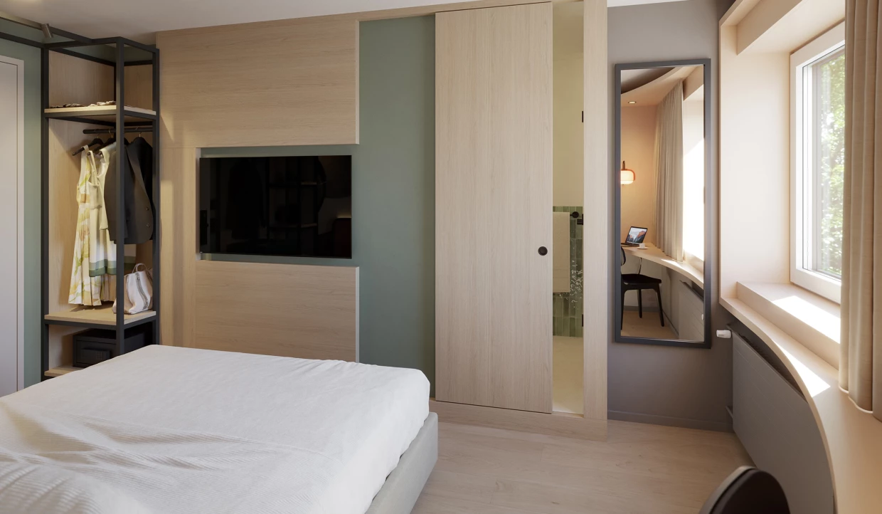 Room view with mirror, wardrobe, and window