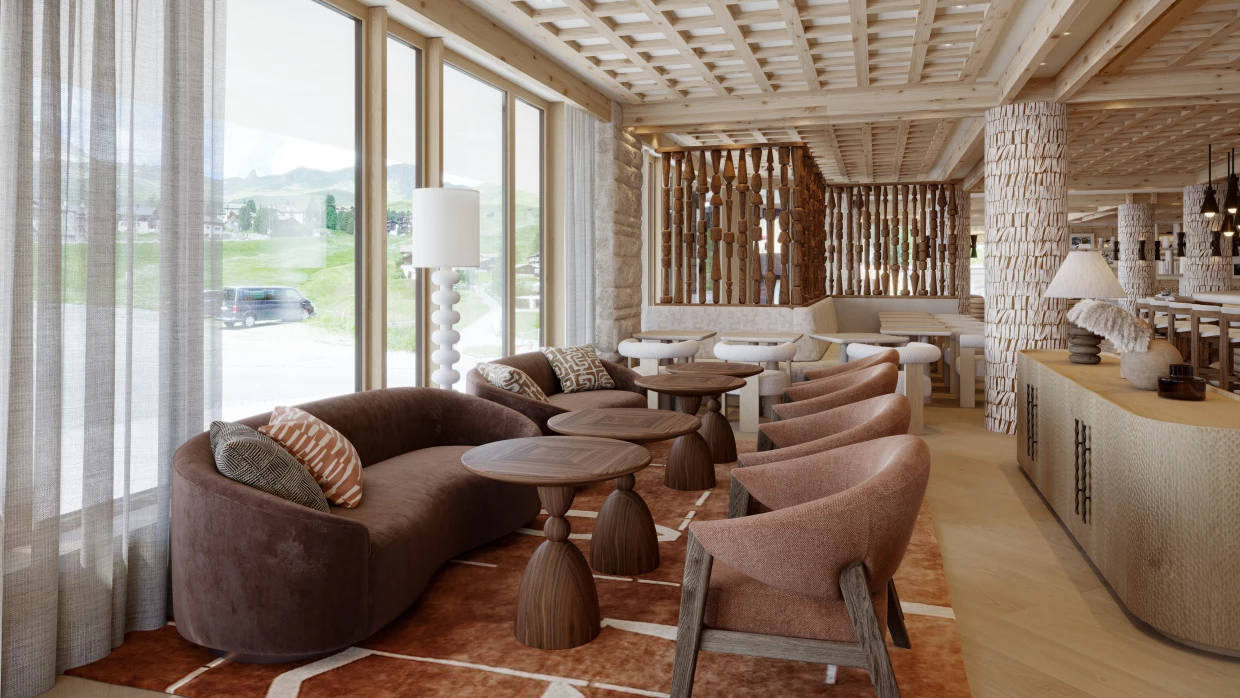 Lobby of a luxury hotel in Graubünden with bulky furniture in brown and beige