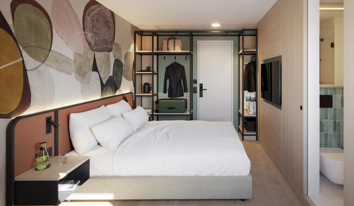 Midcentury hotel room with double bed and 50s wall decoration