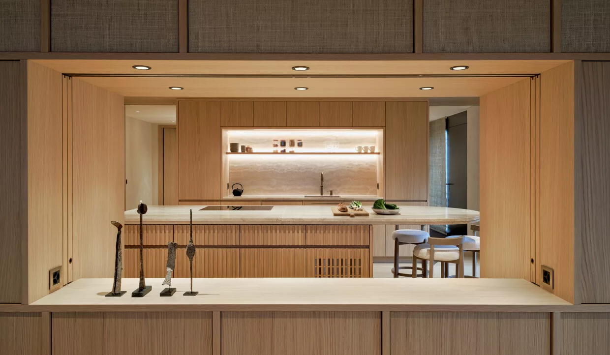 Kitchen with open pass-through and wood paneling