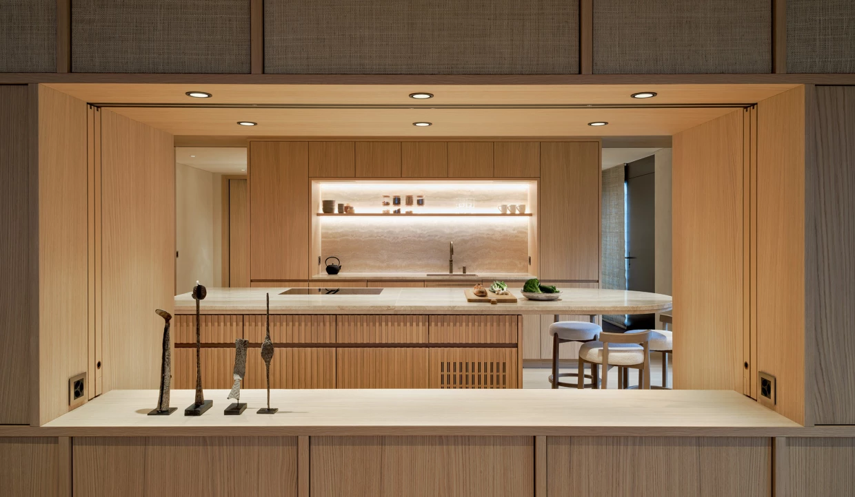 Kitchen with open pass-through and wood paneling