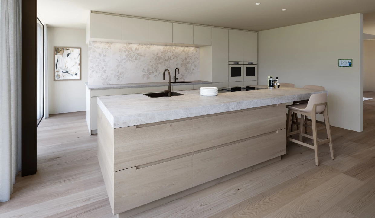 Moderne Küche mit großer Insel und zwei Barhockern