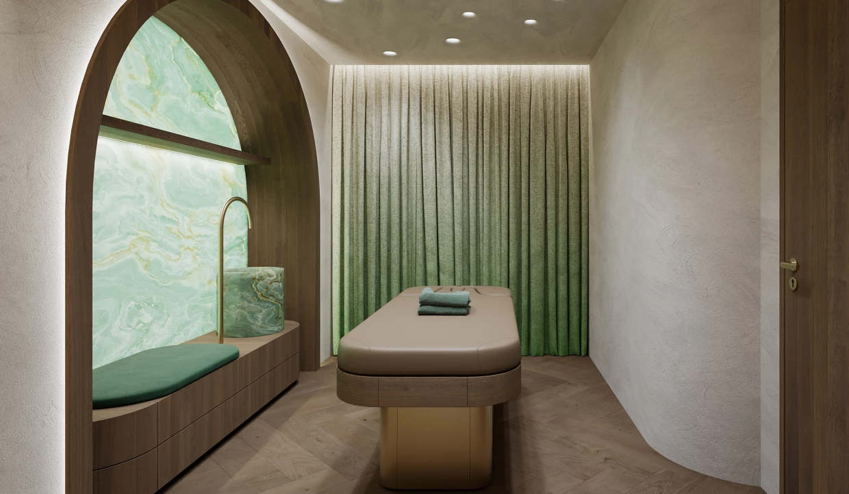 Room with massage table, green wall, and curtain