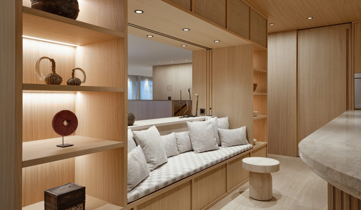 Sitting area in kitchen with cushions and shelves