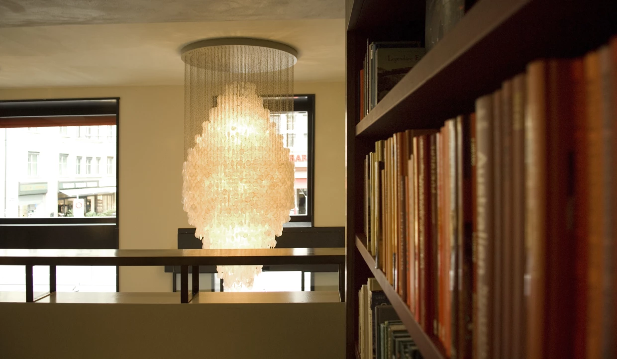 Large chandelier near a bookshelf