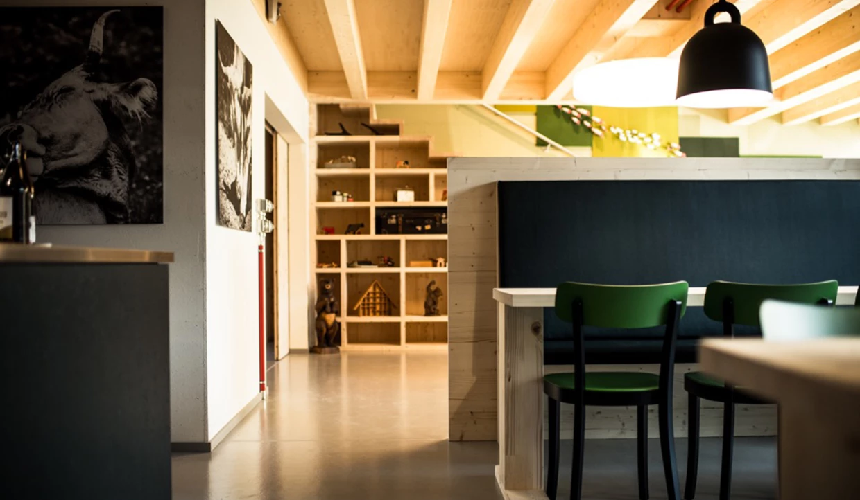 Wooden room with shelves, chairs and large poster