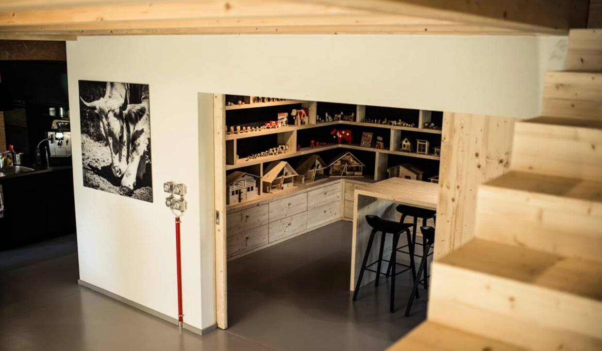 View into a room with shelves full of figures
