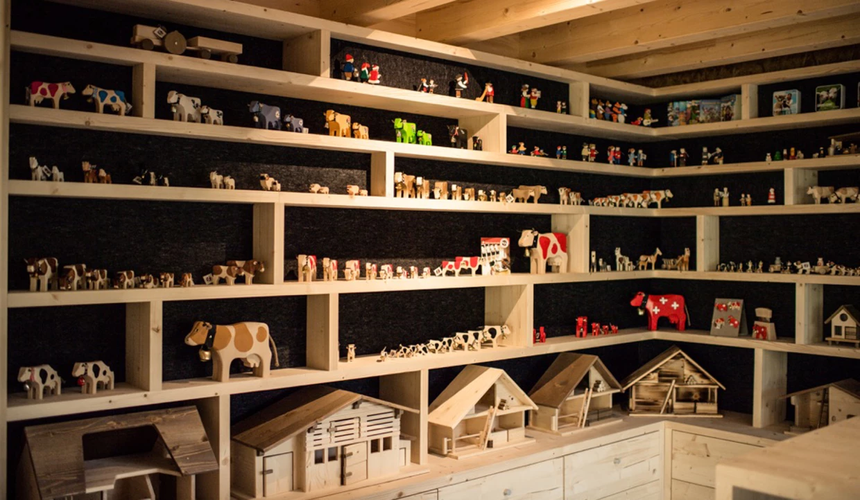 Shelves with a variety of small wooden figures