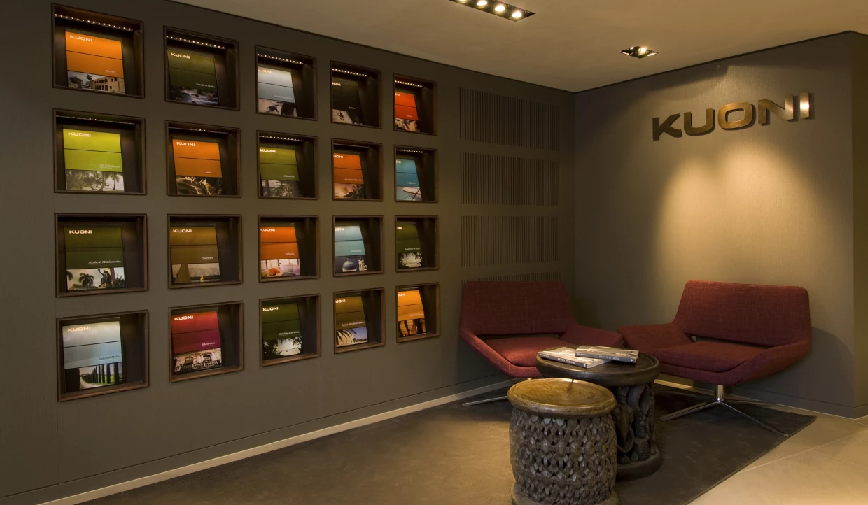 Wall with colorful brochure holders and red chairs